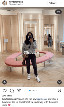 person at glossier pop up shop