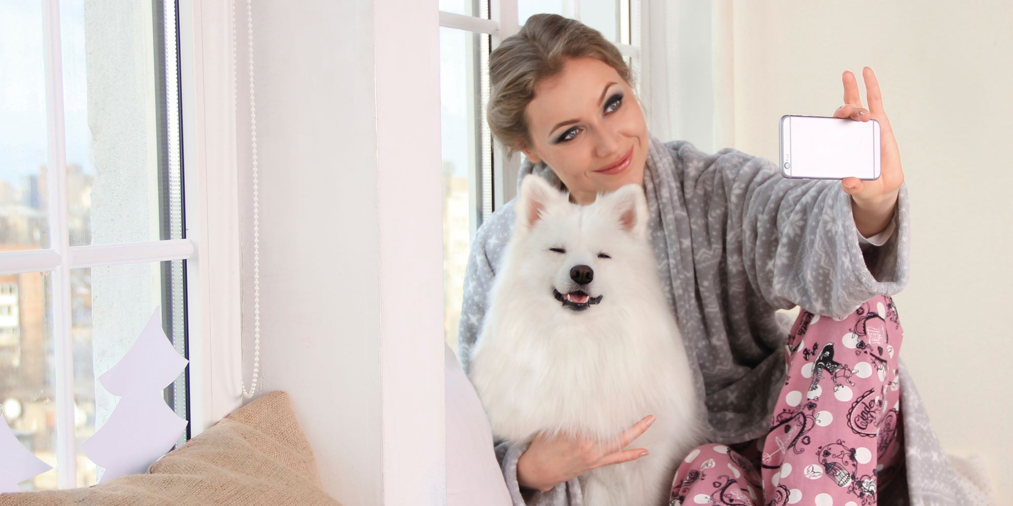 Woman and dog taking photo