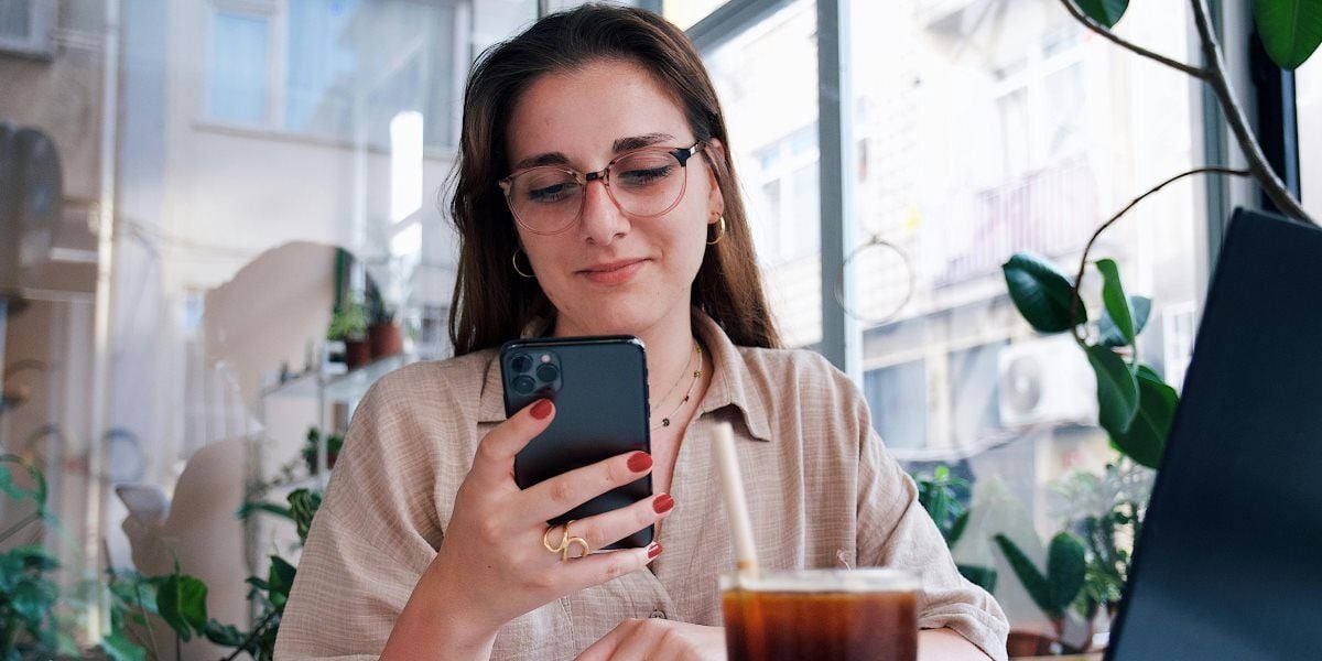 woman on cell phone in coffee shop